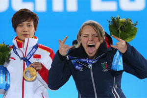 Silver Medalist Arianna Fontana on the podium at the 2014 Olympic Games (Photo by Quinn Rooney/Getty Images).