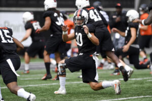 Oregon State University Football's Drew Kell Stretches with Team