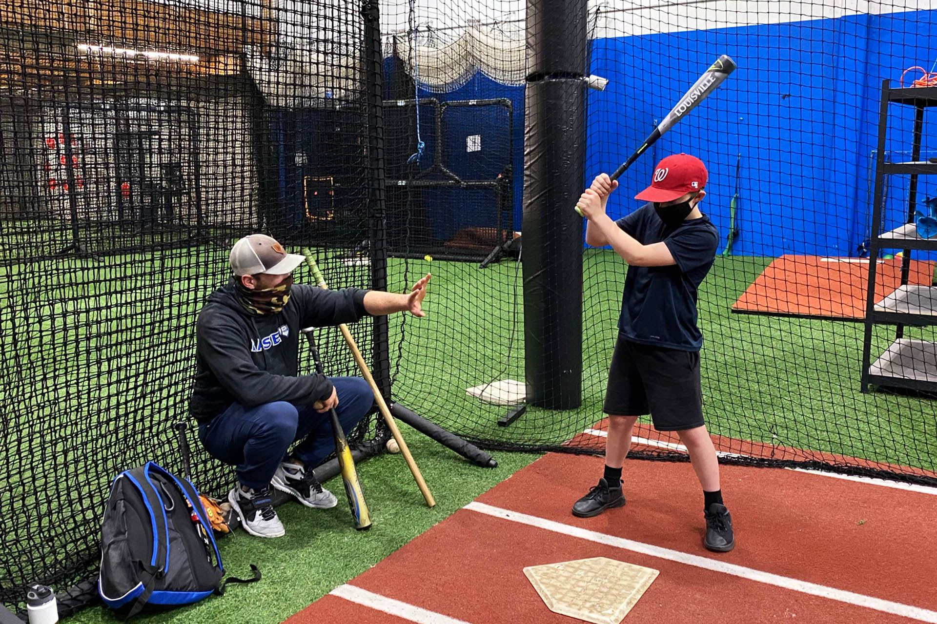 Boy Receiving Baseball Hitting Instruction