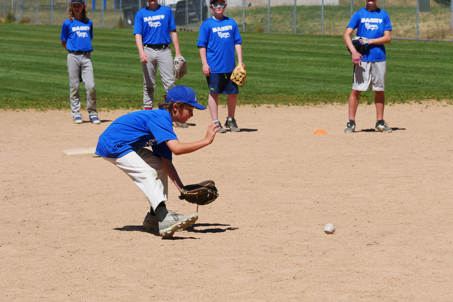 Boy Fields Ball at BASE by Pros Baseball Camp