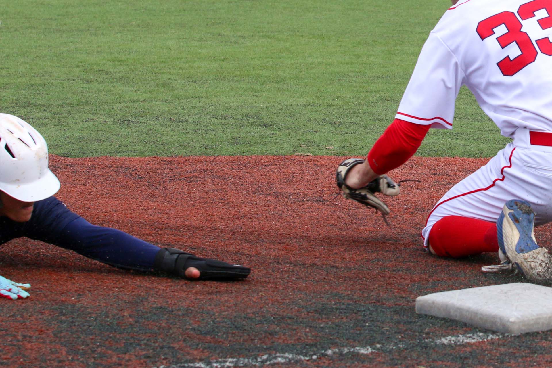 Baseball Player Slides Into Third Base