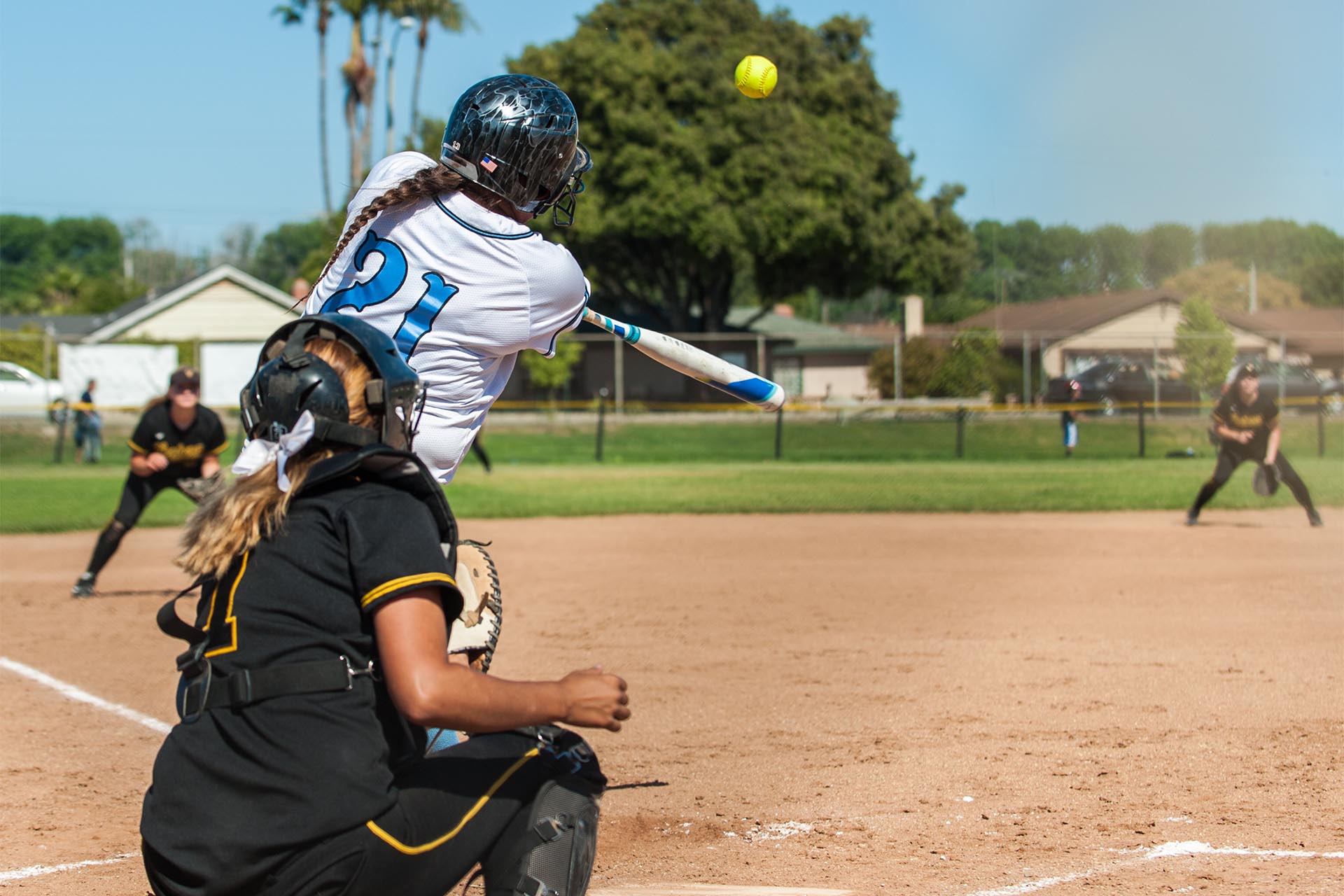 Softball Player Hits Ball