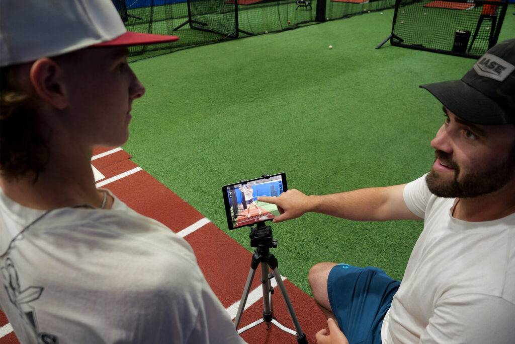 Coach Ben Offering Baseball Instruction with an iPad