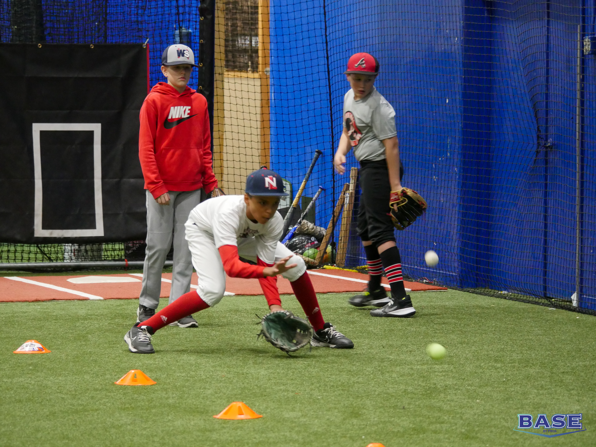 Player Fielding a Ball at an Infield Clinic