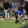 Player Fielding a Ball at an Infield Clinic