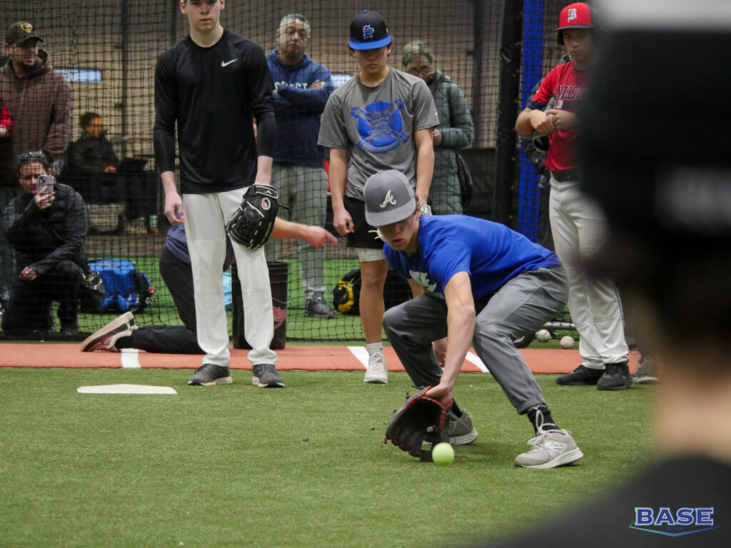 Player Fielding a Ball at an Infield Clinic