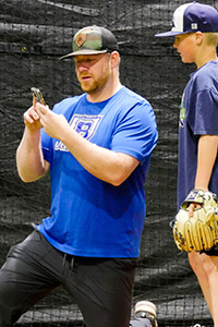 Coach Aaron West Reviews Footage with a Pitcher