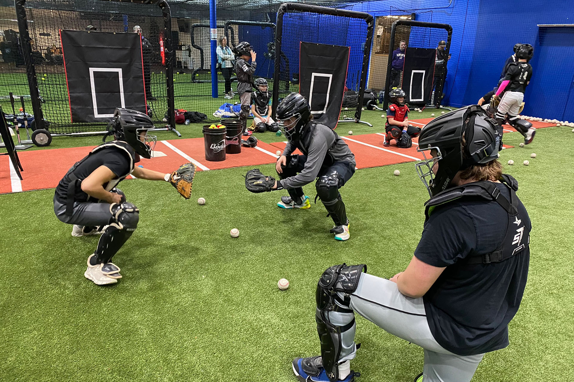 Catchers Working on a Drill at Catching Camp in Lynnwood