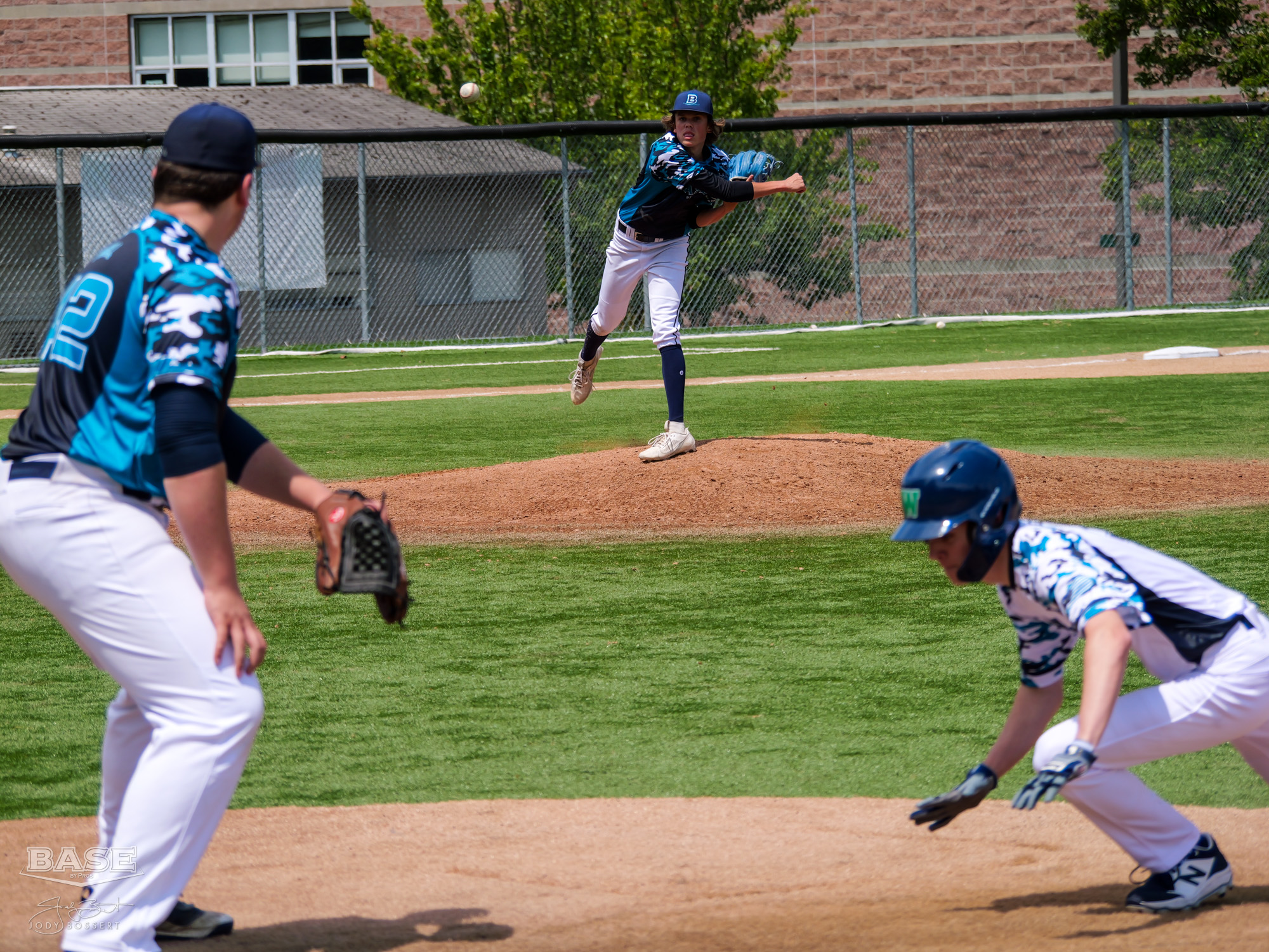 Pitcher Throws Over to First Base During BASE by Pros Summer League 2023