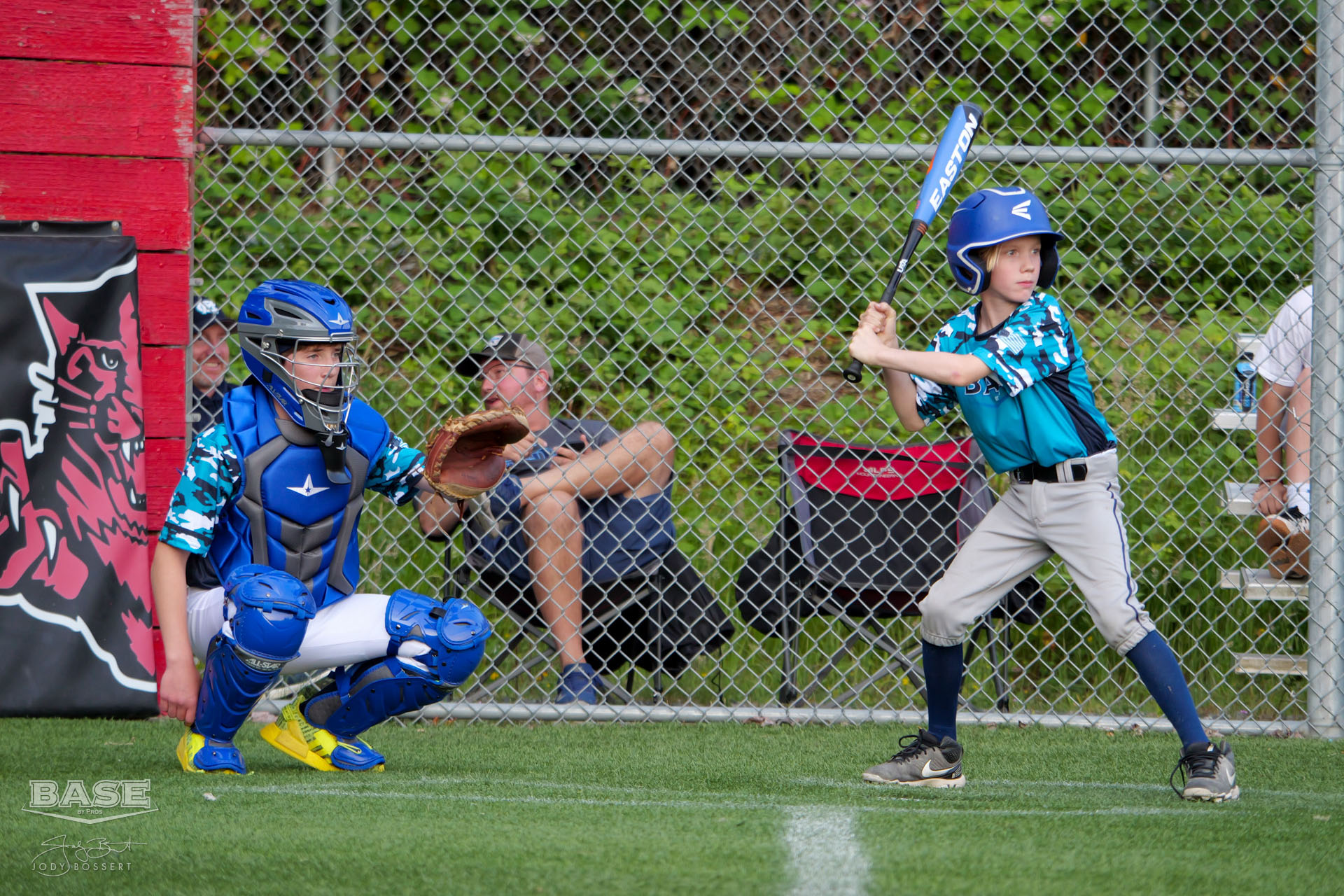 A catcher and batter await the pitch at BASE by Pros Summer Sluggers 2023