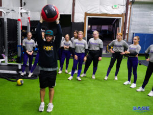 Demonstrating Med Ball Exercises in the Gym at BASE by Pros - Skagit