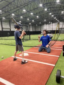 Hitting Instructor Working with a Youth Baseball Player at BASE by Pros - Skagit