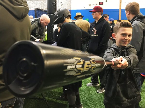 Boy Reaching with Bat at Bat Demo Day at BASE by Pros on Dec. 9, 2017